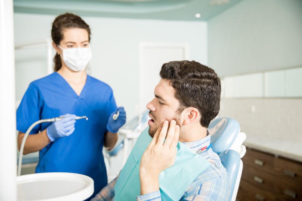 a man is getting dental treatment